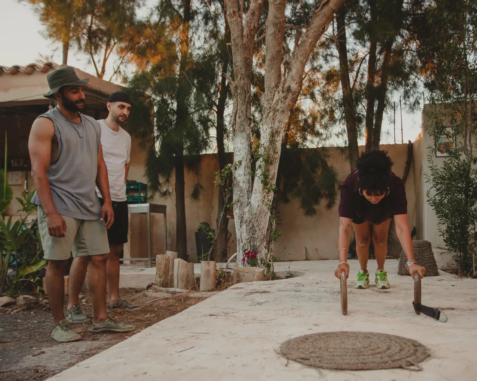 A girl doing push-ups during a training session at Farm El Baya